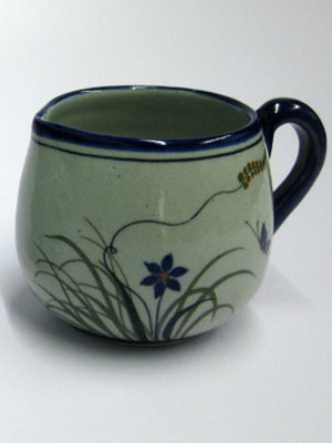 Butterfly Dinnerware / 'Blue Rim Butterfly' Creamer / Ideal for a midday coffee or tea with friends, this creamer is adorned with a butterfly, flowers and grass bordered with a cobalt blue rim.