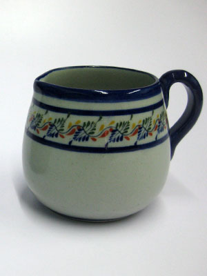 MEXICAN STONEWARE / 'Tropical' Creamer / Ideal for a midday coffee or tea with friends, this creamer is adorned with a multicolor motif resembling tropical flowers.