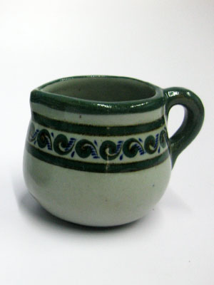 MEXICAN STONEWARE / 'Green Rim Paisley' Creamer / Ideal for a midday coffee or tea with friends, this creamer is adorned with a green and blue paisley pattern, bordered with a green rim.